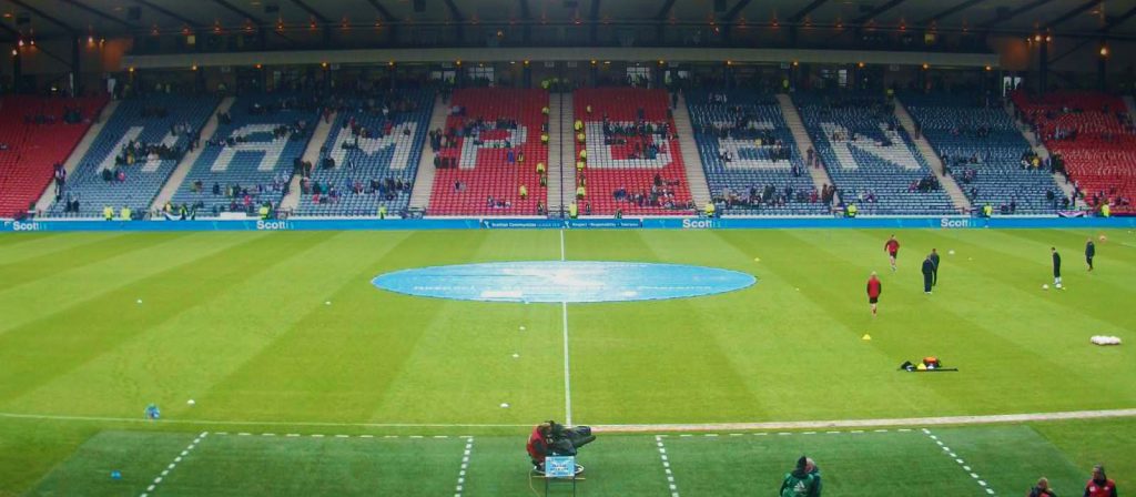 The Hampden Stadium with players warming up.